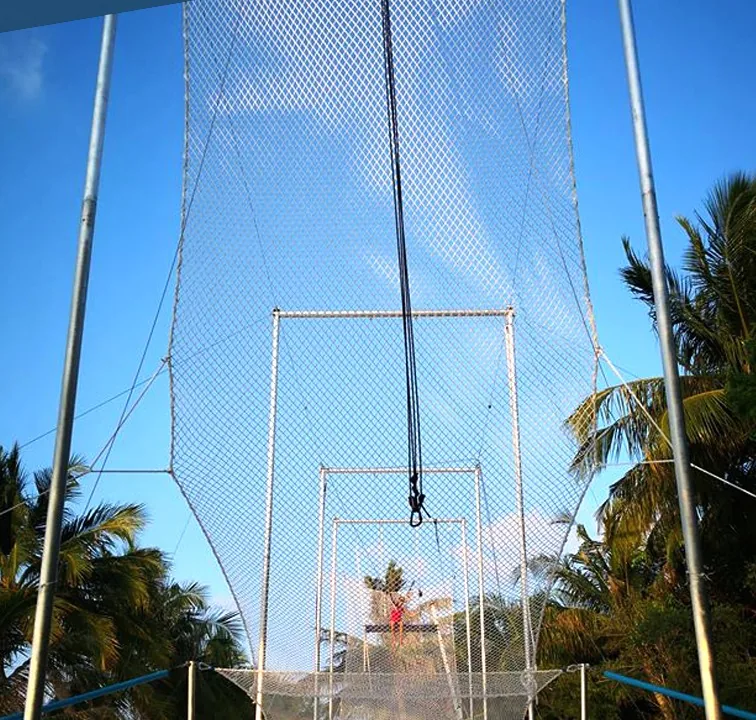Flying trapeze rig frame and net during beachfront installation — MACA flying trapeze rig