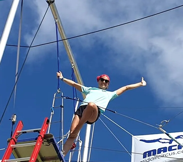 MACA technician at height during a maintenance inspection of a flying trapeze rig — MACA flying trapeze rig